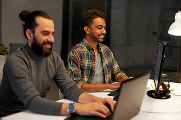 Image showing creative team with computer working late at office