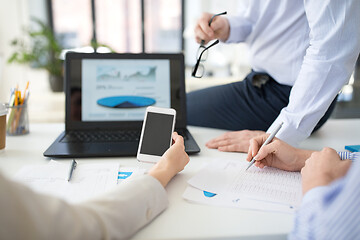 Image showing business team with smartphone working at office