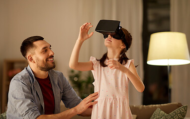 Image showing father and daughter in vr glasses playing at home