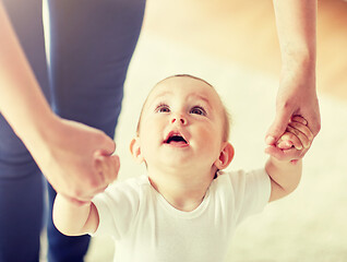 Image showing happy baby learning to walk with mother help