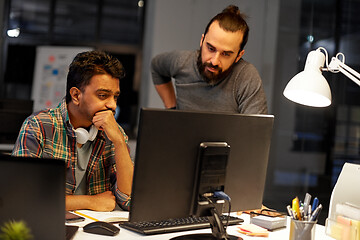 Image showing creative team with computer working late at office