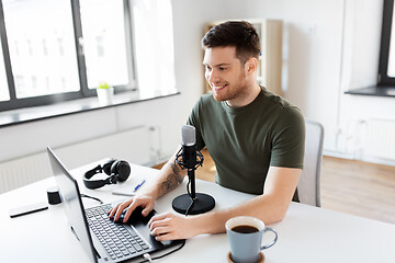 Image showing blogger with laptop and microphone audio blogging