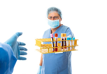 Image showing Hospital staff hands over blood test  i to another laboratory wo