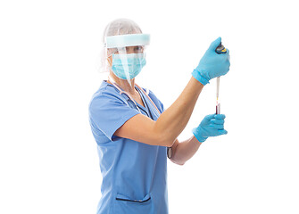 Image showing Hospital worker pipetting blood from a tube for analysis