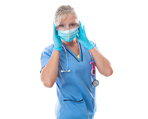 Image showing Female nurse putting on protective medical mask PPE