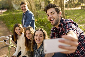 Image showing Friends in the park making a selfie