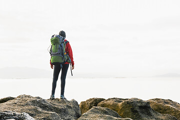 Image showing Woman exploring the coast