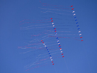 Image showing Red, white and blue kites