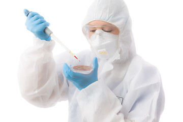 Image showing Laboratory worker wearing protective hazmat biosecurity suit ana