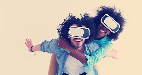 Image showing multiethnic couple getting experience using VR headset glasses