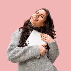 Image showing Businesswoman hugging laptop. Love to computer concept.