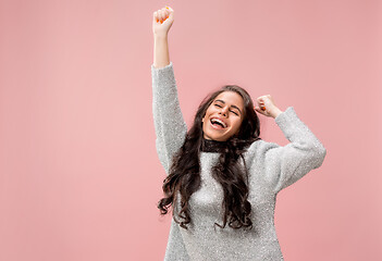 Image showing Winning success woman happy ecstatic celebrating being a winner. Dynamic energetic image of female model