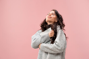 Image showing Businesswoman hugging laptop. Love to computer concept.