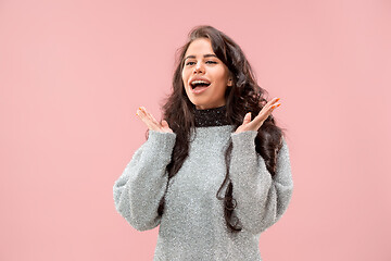 Image showing Beautiful woman looking suprised isolated on pink