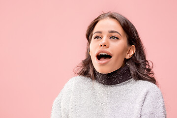 Image showing Beautiful woman looking suprised isolated on pink