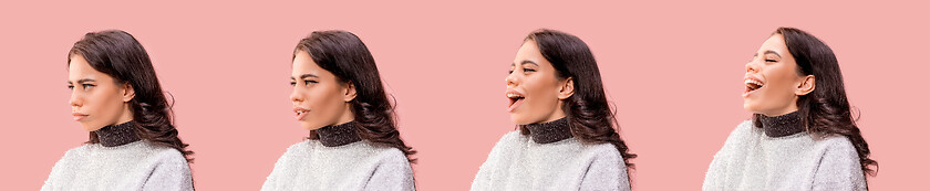 Image showing The happy business woman standing and smiling against pastel background.