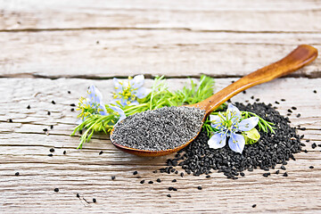 Image showing Flour of kalingi in spoon with flower on old board