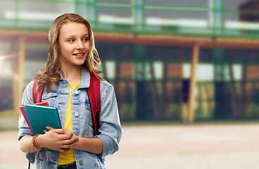 Image showing happy smiling teenage student girl with school bag