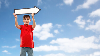 Image showing boy holding big white rightwards thick arrow