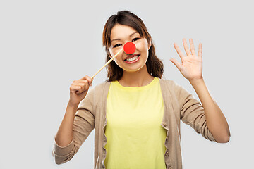 Image showing happy asian woman with red clown nose