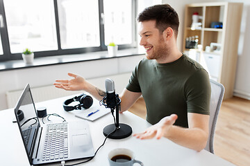 Image showing blogger with laptop and microphone audio blogging