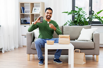 Image showing indian man using smartphone for food delivery