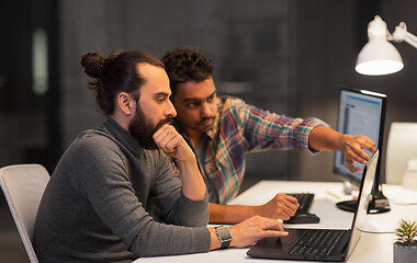 Image showing creative team with computer working late at office