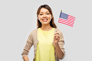 Image showing happy asian woman with american flag