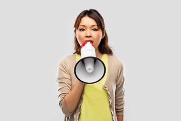 Image showing asian woman speaking to megaphone