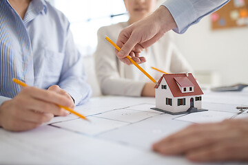 Image showing close up of architects discussing house project