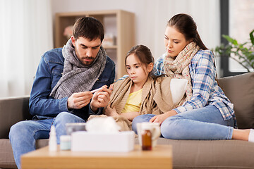 Image showing family with ill daughter having fever at home