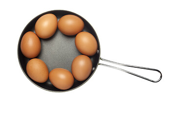 Image showing Frying pan with seven eggs