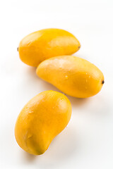 Image showing Fresh honey mango fruits on white background