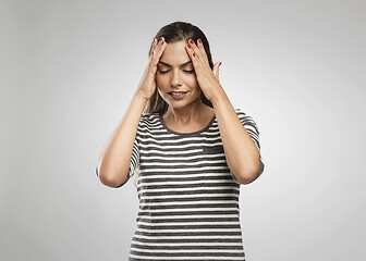 Image showing Woman felling a headache