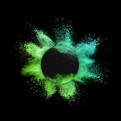 Image showing Decorative round frame with powder splash on a black background.