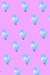 Image showing Blue latex glove as balloons pattern on hot pink background.