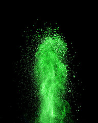 Image showing Vertical green powder splash or explosion on a black background.