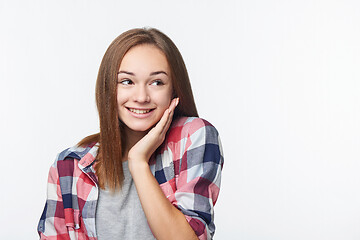 Image showing Surprised teen girl looking to the side