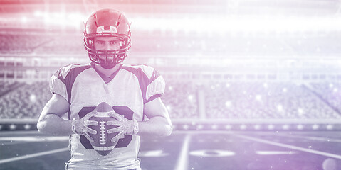 Image showing American Football Player isolated on big modern stadium field