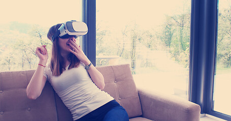 Image showing woman using VR-headset glasses of virtual reality