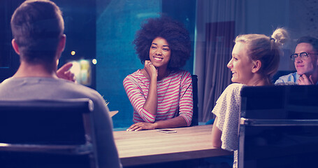 Image showing Multiethnic startup business team in night office