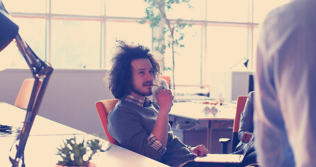 Image showing businessman working using a laptop in startup office