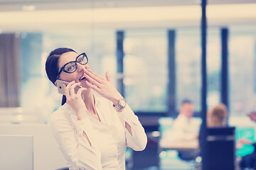 Image showing Elegant Woman Using Mobile Phone in startup office building