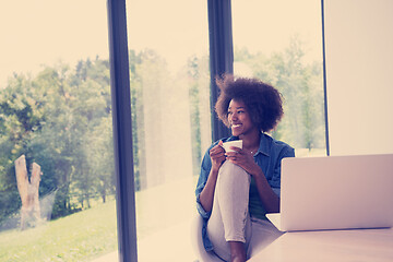 Image showing African American woman in the living room