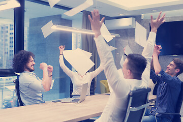 Image showing startup Group of young business people throwing documents