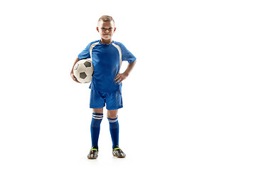 Image showing Young fit boy with soccer ball standing isolated on white