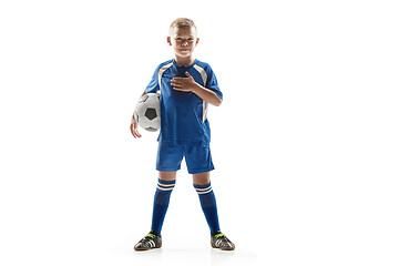 Image showing Young fit boy with soccer ball standing isolated on white