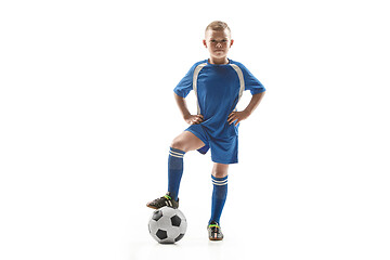 Image showing Young fit boy with soccer ball standing isolated on white