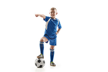 Image showing Young fit boy with soccer ball standing isolated on white