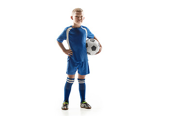 Image showing Young fit boy with soccer ball standing isolated on white